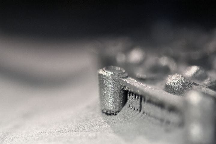 Printing platform with object printed on 3d printer for metal and covered metallic powder