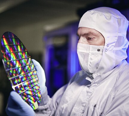 Cleanroom employee with wafer